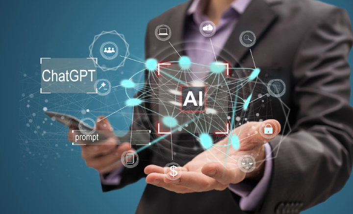 TechDogs- "An Image Showing A Business Professional Using AI Technology"